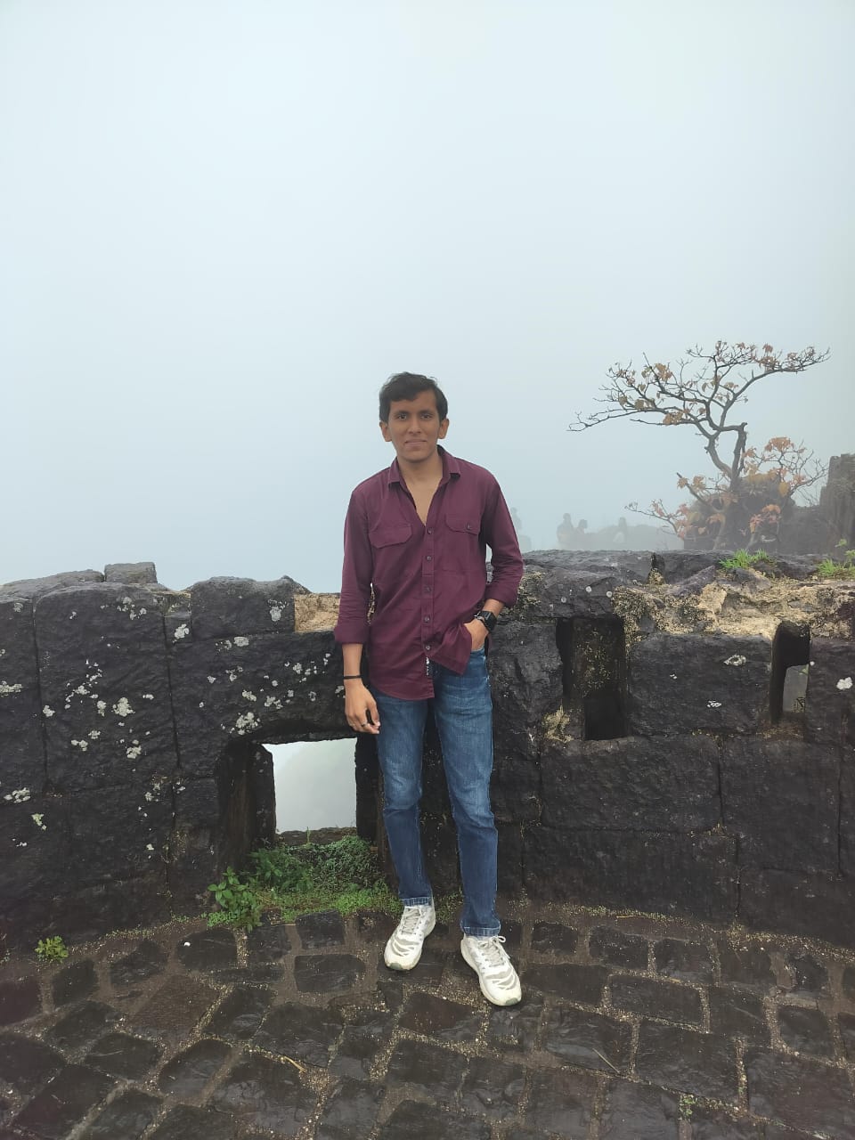 Professional headshot of young college student wearing formal attire